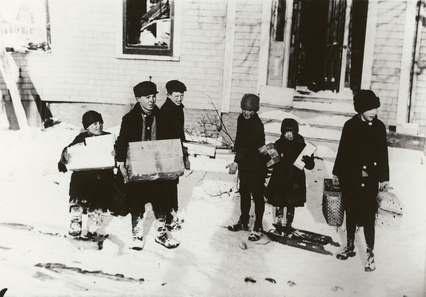 "Children getting food from a relief station"