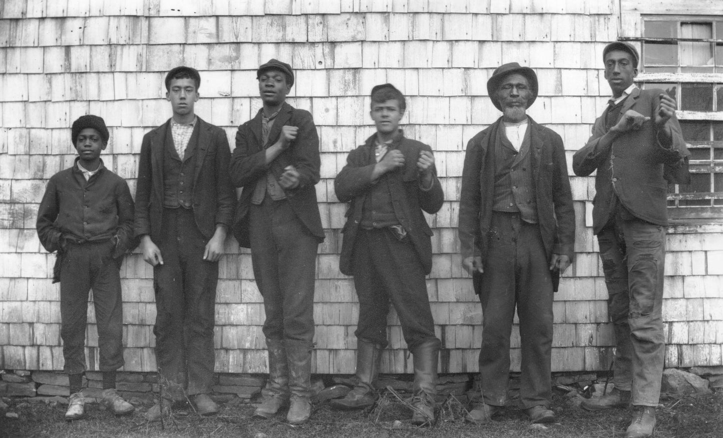 Group of men posing in front of a barn at Guysborough