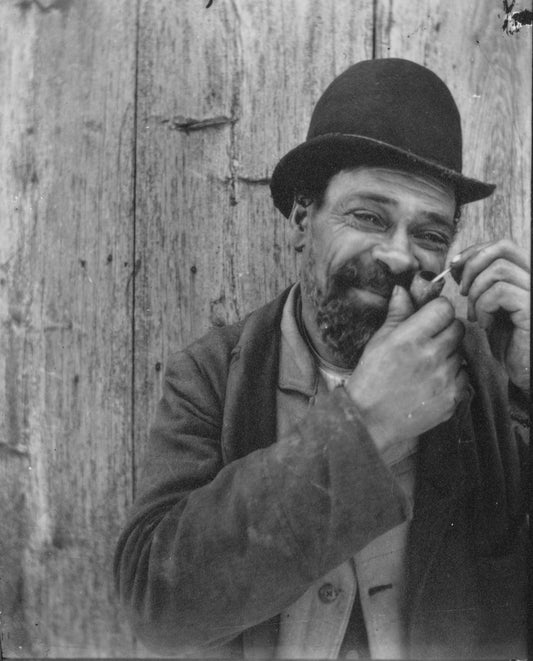 Man lighting his pipe, Guysborough