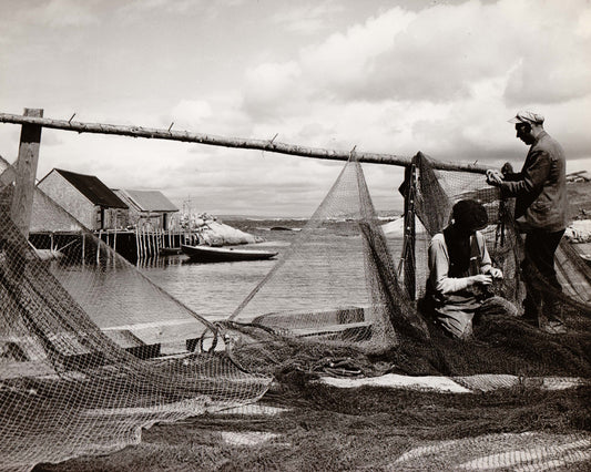 Fishermen mending nets at Peggy's Cove