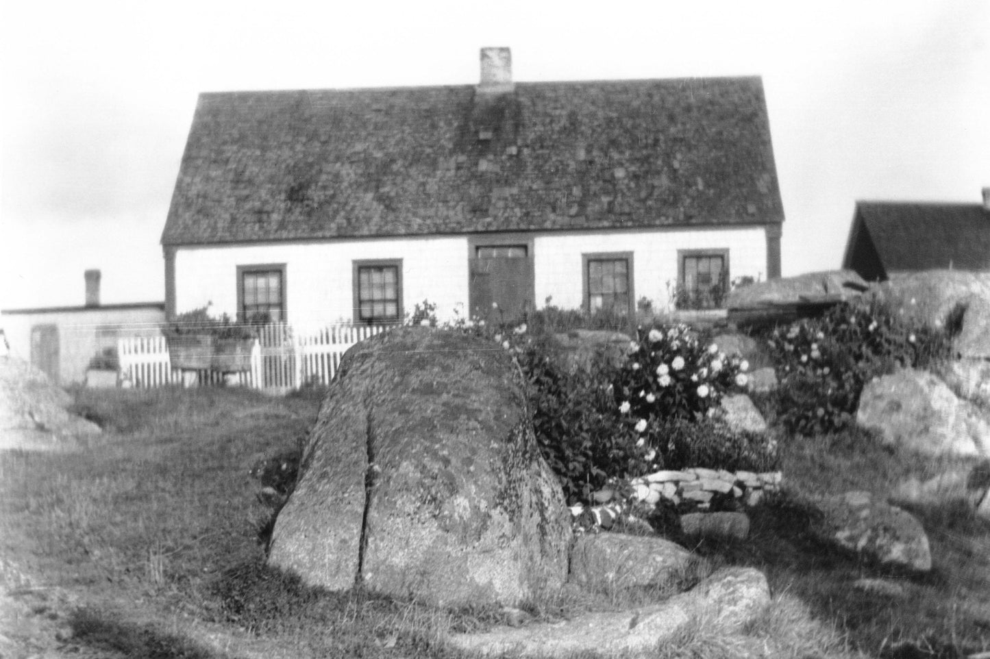 Cottage with picket fence and rock garden, Peggy's Cove