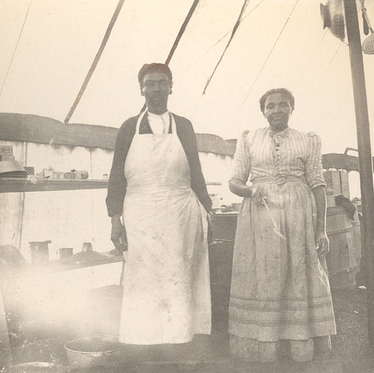 Couple posing in their cooks' aprons at the YMCA Maritime Boys Camp, Cow Bay, near Silver Sands Beach