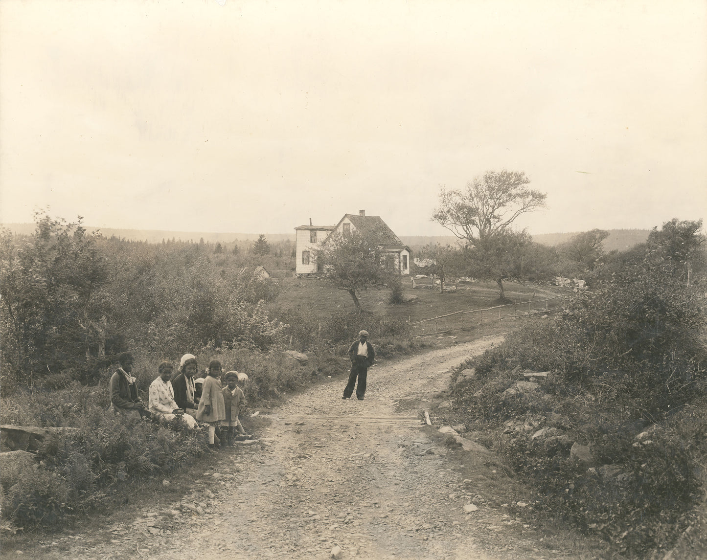 House at North Preston, with group of children in the foreground