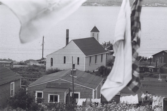 Rear view of Seaview African United Baptist Church, with Africville houses and laundry flapping in the breeze in the foreground