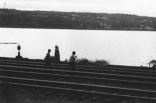 Walkers on the railroad tracks, Africville