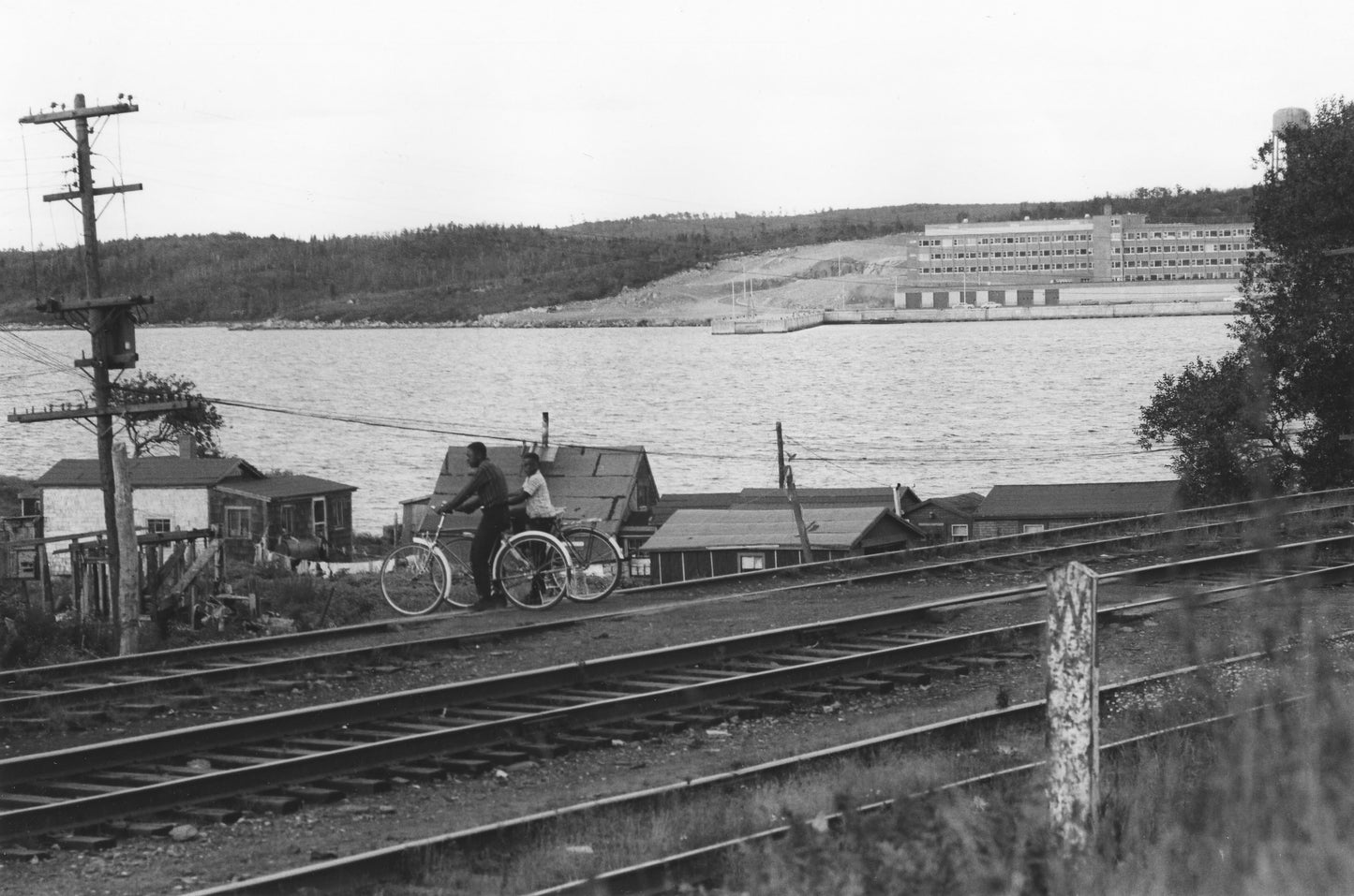 Africville bicyclists by the railroad tracks