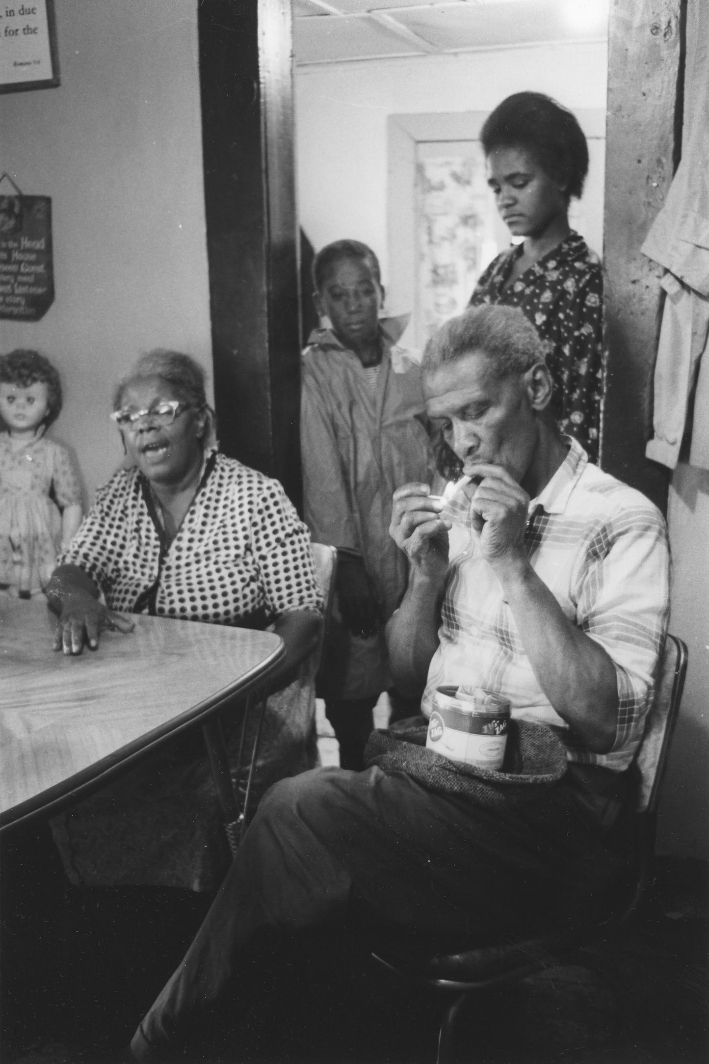 Discussion at dining room table, Africville