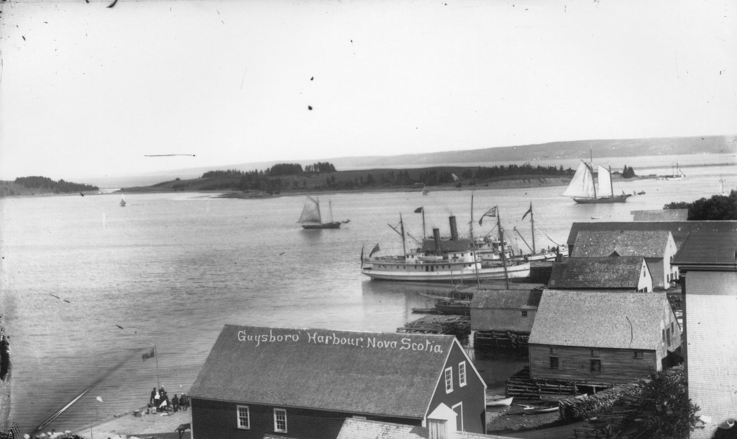 Guysborough Harbour, Nova Scotia (view of waterfront buildings and vessels at the dock, Guysborough, N.S.