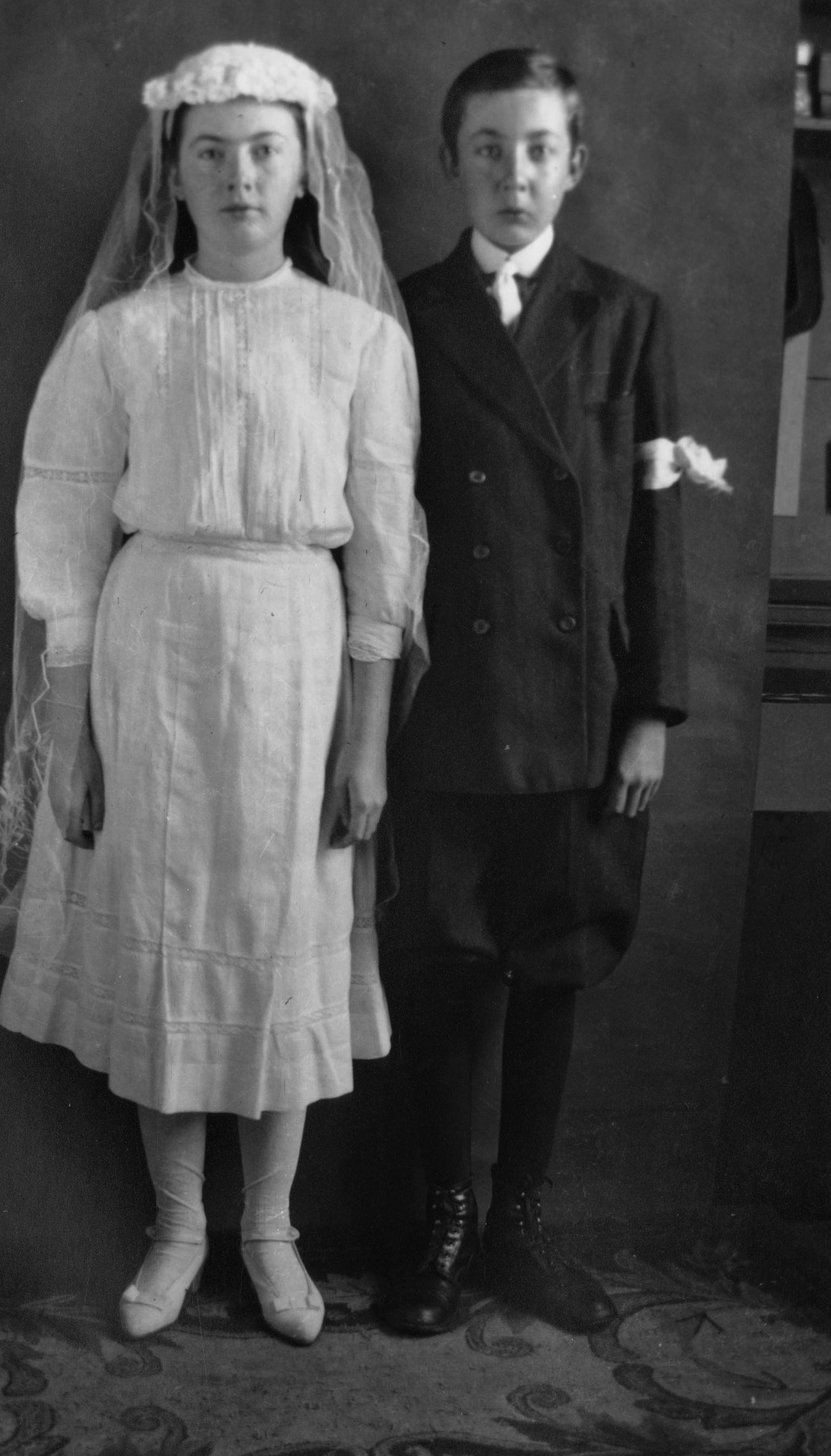 Boy and girl dressed for first communion or confirmation