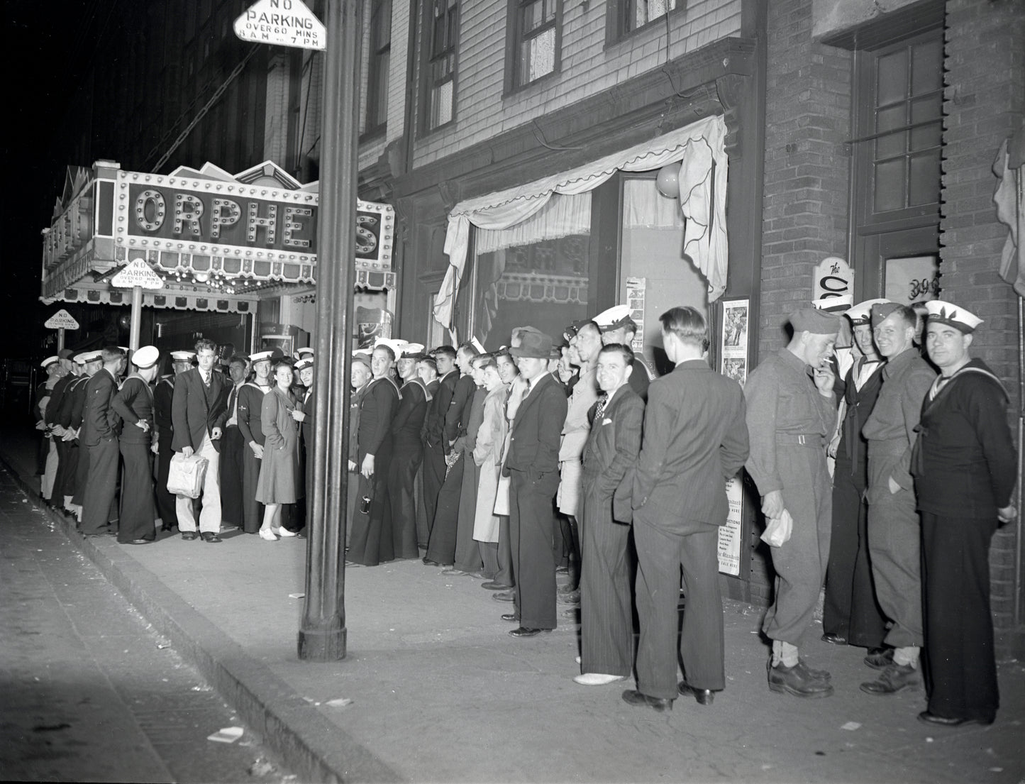 Service personnel and civilans at Orpheus movie theatre, Barrington Street, halifax