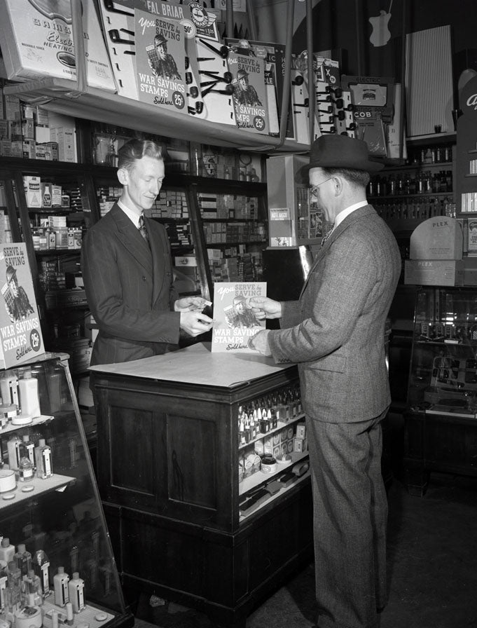 Interior of store with War Savings Stamps display