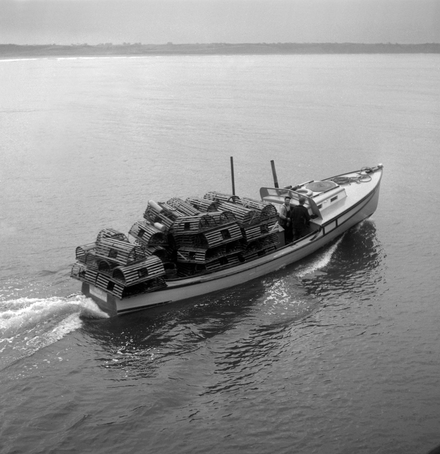 The boats put out to sea, loaded with traps, on the first day of the lobster season