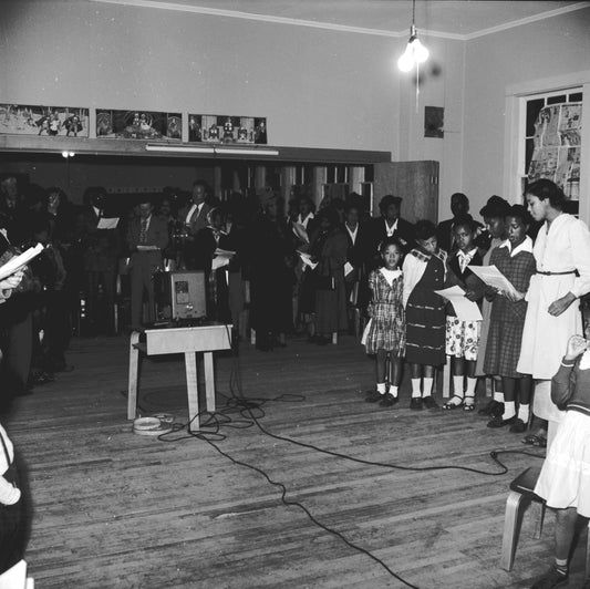 Group singing after the presentation of the Dent citizenship trophy